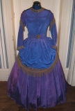 I had more fabric and fringe left, so why not make an 1869 apron style drape for the skirt?