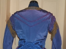 Back detail of 1869 bodice - the self fabric braid continues into points on the back of the bodice.